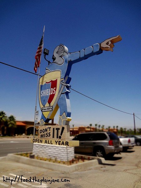 suit-of-armor-shields-date-farm-sign