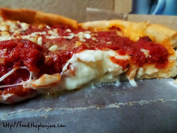 cheesy filled deep dish closeup - berkeley pizza