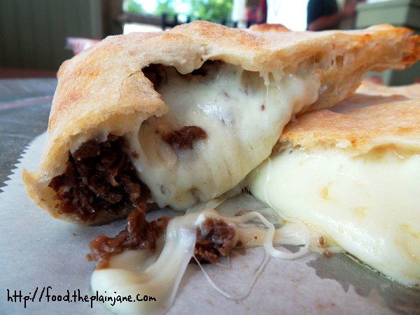 Oozy, melting, gooey cheese inside Calzone | Big Daddy's Pizza and Steak Subs - Boston, MA