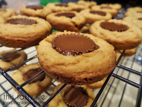 Slightly melted Peanut Butter Cup Cookies | This Tasty Life - http://food.theplainjane.com
