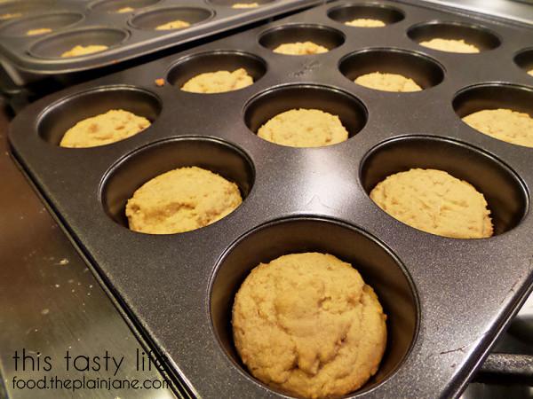 Baking the peanut butter cup cookies in a muffin pan | This Tasty Life - http://food.theplainjane.com