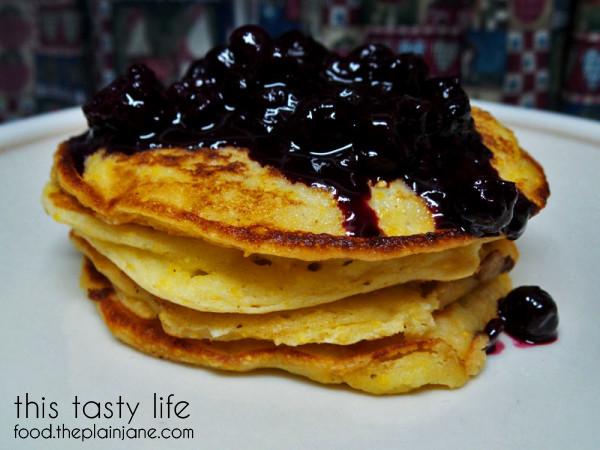 National Blueberry Pancake Day: Lemon Cornmeal Pancakes with Berry Sauce from Driscoll's @driscollsberry #BlueberryPancakeDay