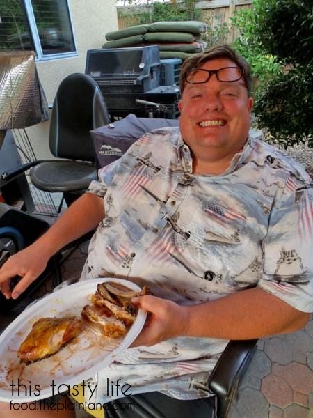 Jake eating smoked chicken