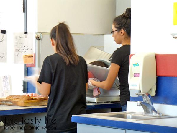 Freshly slicing the meat | College Sub Shop - San Diego, CA