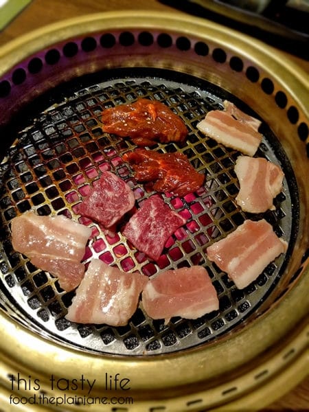 Meats grilling on the hot grill | Gyu-Kaku Japanese BBQ - Scripps Ranch / San Diego, CA