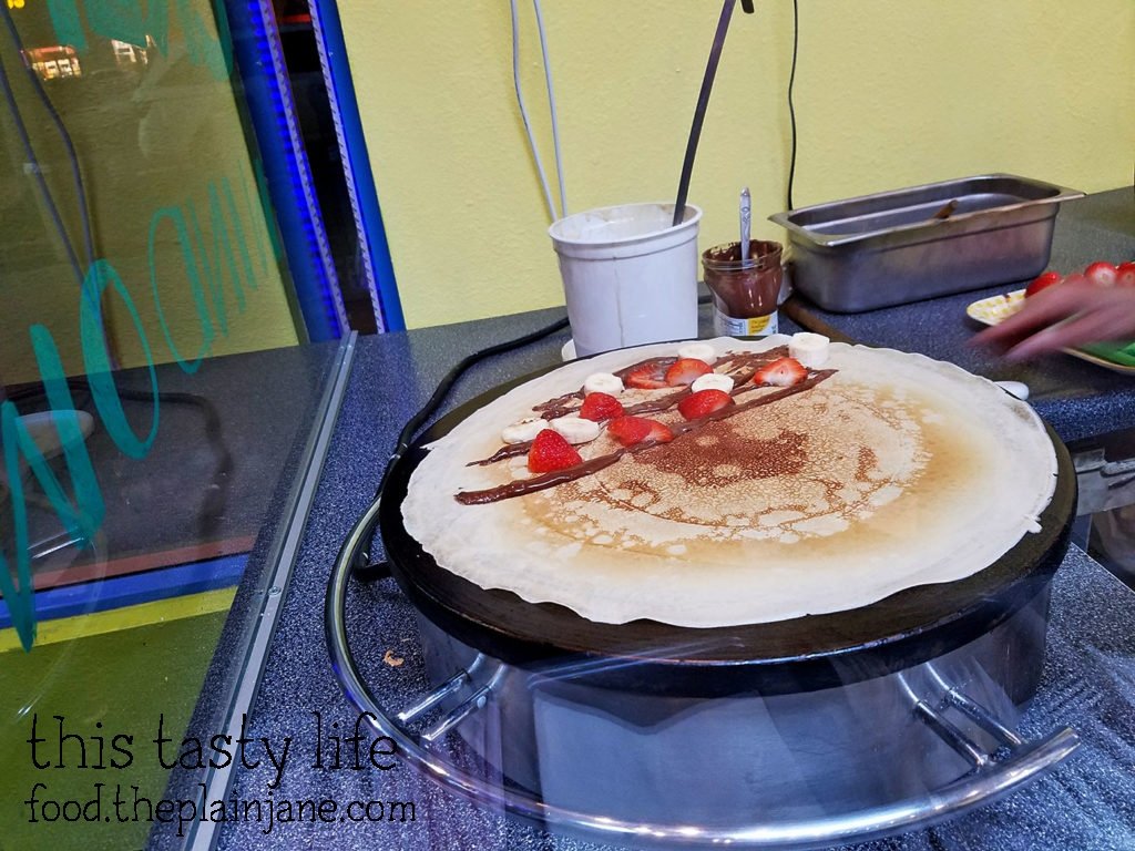 Adding fruit to the crepe at Fruteria La Buga - San Diego, CA - This Tasty Life