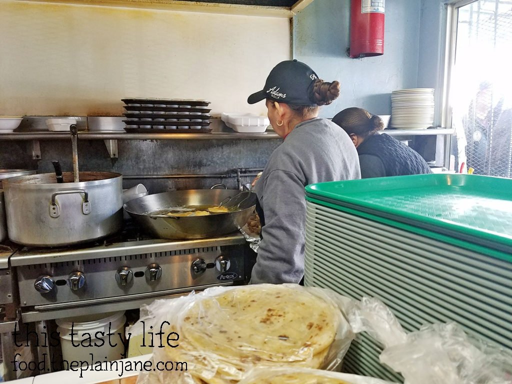 Ladies making fresh tacos at Las Cuatro Milpas | San Diego, CA | This Tasty Life