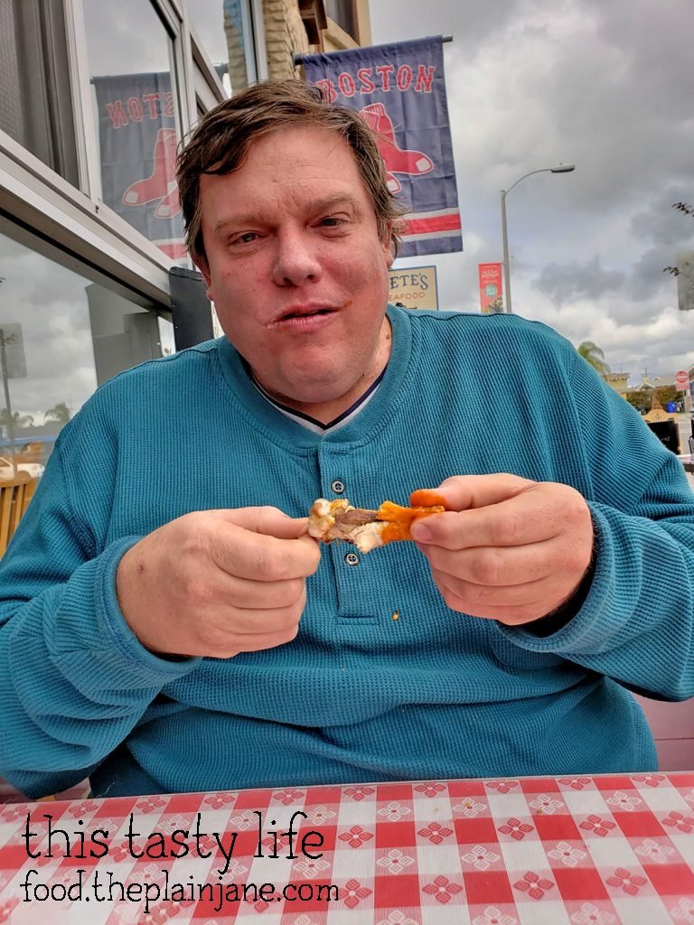 Jake eating wings at Pete's Seafood - North Park - San Diego, CA